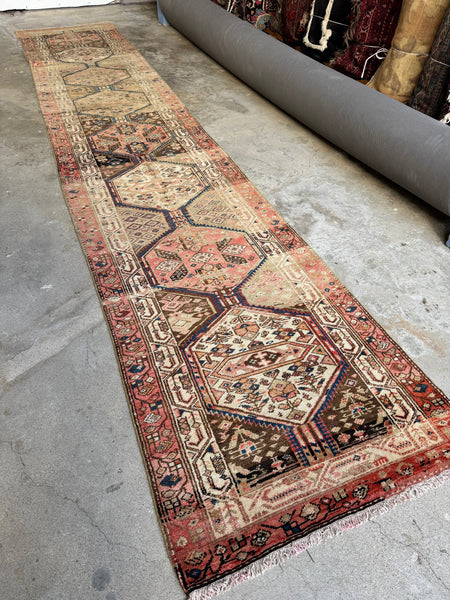 Antique Northwest Persian Gharajeh runner with eight medallions and soft pastel palette.