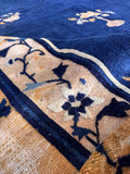 Hand-knotted blue wool area rug close-up of the lustrous vegetable-dyed wool pile and natural sheen.