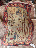 Authentic 1900s Persian Tabriz rug full shot illustrating original symmetry, dark red borders, and soft green field.