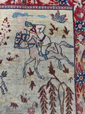 Vintage animal motif Persian rug detailed view showing running deer, flying birds, and intricate botanical elements.