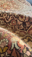 Apricot and peach hues creating a gentle palette in the Persian rug.