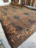Antique Persian Bibikabad rug from the 1920s with lake blue accents on a terra cotta ground.