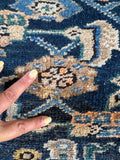 Patch detail on vintage Hamadan runner.