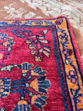 Vintage hand knotted wool accent rug featuring full pile and natural vegetable dyes.