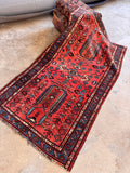 Antique Persian Malayer rug in 2x5 size showcasing a vibrant coral watermelon field with blue borders.