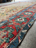 Antique wool Caucasian runner, collectible tribal hallway rug with a faded ivory field, geometric artwork, and rich vegetable dyed colors.
