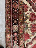 Authentic 1910s Persian Bakhtiari rug with geometric diamond grid pattern and floral borders.