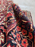 Antique Persian carpet. Hand knotted Heriz rug with full wool pile, beautiful floral borders, and remarkable durability for everyday living.