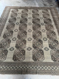 10x11 beige Persian area rug. Antique Shiraz rug with repeating geometric medallions and a collected, relaxed feel.