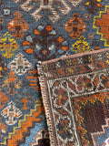 Underside view of small antique Persian Shiraz weave texture and vegetable dyed wool.