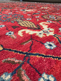 Vintage Persian Tabriz rug with warm red and orange undertones and vegetable-dyed wool.