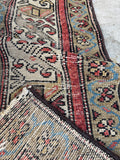 3x12 Persian corridor runner with an intricate field and decorative borders.