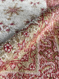Vintage rug close-up detailing the luxe, soft-to-the-touch hand-knotted wool pile.