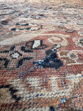 Vintage Mahal rug close up of vegetable dyed terracotta wool with rich muted color variations.