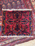 Antique Persian scatter rug woven with vegetable dyed wool.