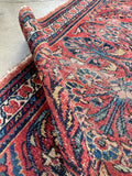 Persian Lilihan accent rug featuring all-natural vegetable dyes and a traditional Iranian floral design.