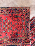 Mini antique Hamadan rug with heavy vegetable dyed wool and coral floral design.