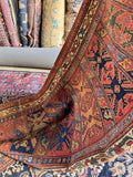 Vegetable-dyed Persian wool rug with beautifully mellowed colors and aged wear.