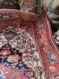 4x7 antique Persian Ferahan area rug with floral vines and worn low pile.