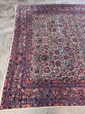 One end of antique Persian carpet showing traditional hand-finishing.