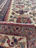 Underside view of Persian Afshar rug showing patina, character, and vibrant patterning.
