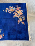 One end view of Handwoven Chinese rug with vegetable-dyed wool and open field design.