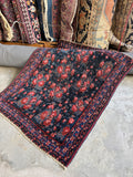 Diagonal view of rug showing pattern and color story.