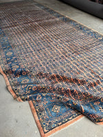 Flexible and heavy-duty antique rug with mink-like feel and floral artwork