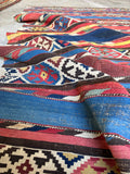 Geometric tribal runner rug 4'9 x 8'9 with horizontal stripes and traditional woven motifs.