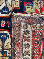 Detailed view of vegetable-dyed wool texture and underside.