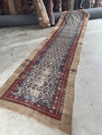 Antique Persian Seraband runner from the 1880s with repeating paisley design.