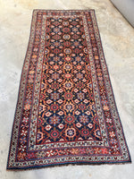 Full view of antique Persian Veramin rug featuring Mina Khani floral pattern