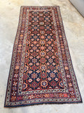 Full view of antique Persian Veramin rug featuring Mina Khani floral pattern
