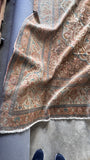 Corner view of the fine, tight vegetable-dyed wool weave on a large antique Persian Tabriz rug.