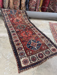 Antique tribal runner from the 1880s, handwoven with vegetable dyed wool.