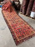 Vintage Persian runner rug with 70’s flower power floral motifs.