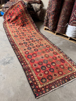 Vintage Persian runner rug with 70’s flower power floral motifs.