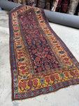 Antique 1880s Persian Bidjar rug with saffron yellow border and Herati pattern.