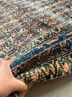Vintage Persian textile with luminous sheen and linear repeating paisley design.