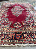 Hand knotted Persian Sarouk rug full view displaying traditional floral artwork throughout.