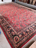Antique Persian rug, approximately 10x18, featuring a dense full pile and vibrant floral patterns.