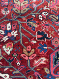 Close up of a vintage Persian Heriz rug from Northwest Persia with vibrant vegetable dyed wool.