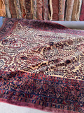 Heavyweight antique Persian wool rug side view demonstrating the thick, dense pile and durable construction.