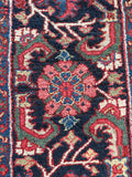 Oversized Persian Heriz rug. Vintage geometric wool area rug with vivid vegetable dyes, ivory accents, and architectural tribal design.