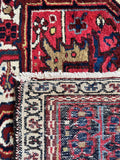 Antique Persian wool rug. Hand knotted Heriz carpet with contrasting guard borders, playful zigzag motifs, and rich natural colors.