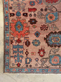 Corner view of 1970s Northwest Persian Heriz rug with coral and aqua accents.