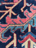 Antique Heriz rug surface showing mellowed vegetable dyes and aged patina.