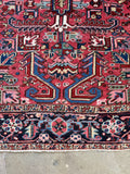 Persian Heriz rug border and field contrast detail.