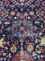 Detail of large-scale linear medallion in center of rug.
