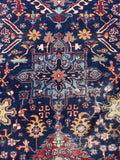 Detail of large-scale linear medallion in center of rug.